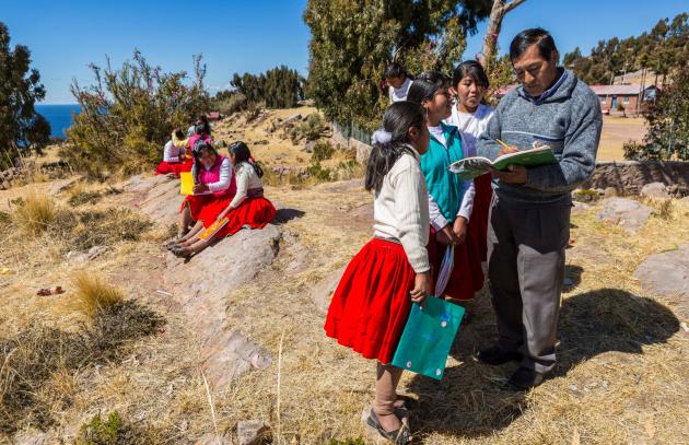 A teacher working with students in Puno province in Peru.